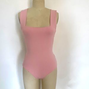 Free people pink bodysuit size small with sexy open back cutouts, snap crotch